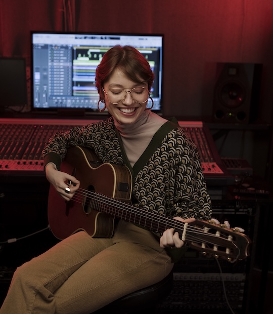 woman playing guitar woman playing guitar